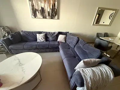 Large L-shaped dark grey velvet sofa — comfortable family sectional