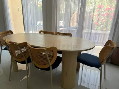 Light Wood Oval Dining Table with 6 Cane-Back Chairs
