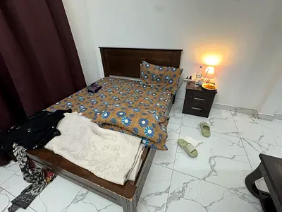 Single wooden bed frame with mattress and bedside table - good condition