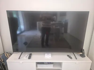 65 Smart LED TV in good condition with remotes and set-top box