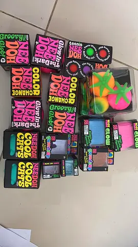 Mixed lot of colorful NeeDoh stress toys and squishy fruit set