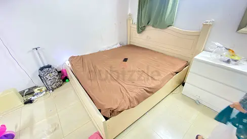 White wooden double bed