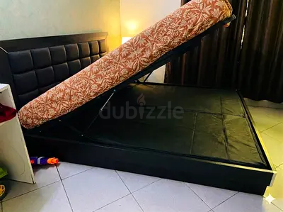Lift-up storage bed included with mattress