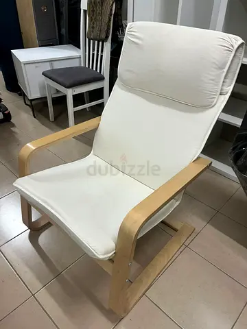 Chair - from IKEA with a natural wood frame and beige cushion