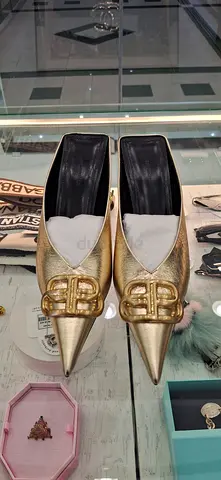 Gold pointed flats with decorative buckle - gently used