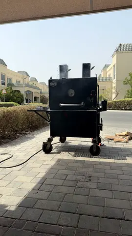 Heavy-duty Black Myron Mixon Wood Smoker/Offset BBQ on Wheels
