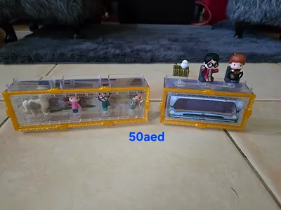 Set of Small Toy Figurines and Mini Vehicle Display - Good Condition both for 50aed