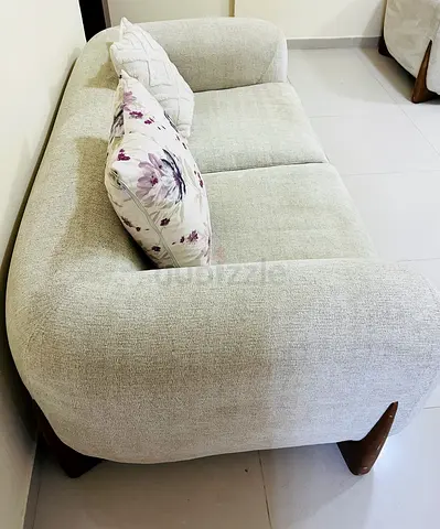 Modern curved loveseat 2 seater sofa.very good condition. Clean and comfortable.No stains or damage