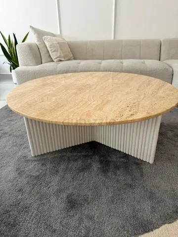 Round marble coffee table with ribbed base