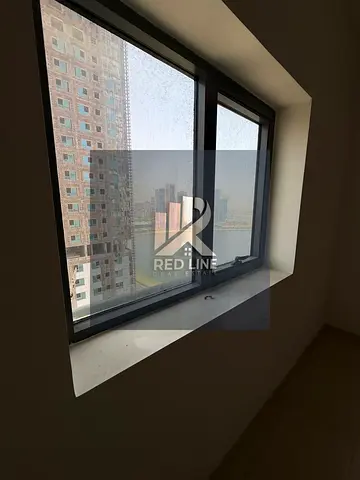 Spacious 2BR apartment in Al Khan with sea view, parking, pool, gym, and free AC.