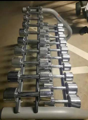 Set of chrome dumbbells with rack — various weights, good condition