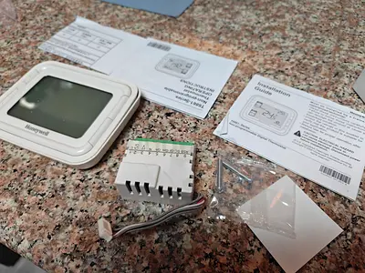 2 X Honeywell thermostat with wiring module and manuals