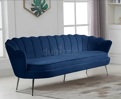 Shell back blue velvet upholstered 3 seater sofa
