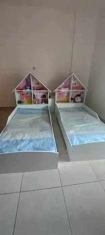 Pair of kids single beds with dollhouse headboards, good condition