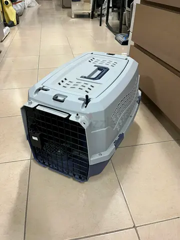 Amazon Basics two-door pet travel bag, featuring a hard design and gray color.