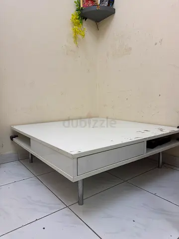 Coffee table with small storage shelve
