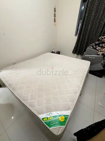 Queen-size Milano mattress — good used condition