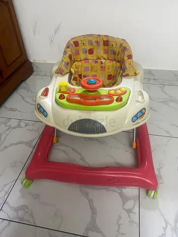 Baby walker with activity tray and padded seat (used)