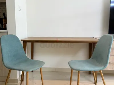 Pair of modern dining chairs with wooden legs