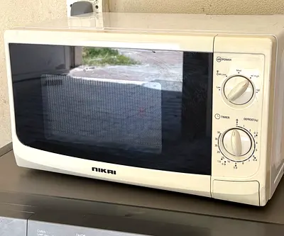 Nikai Microwave Oven – Manual Dial Controls, Used Good Condition