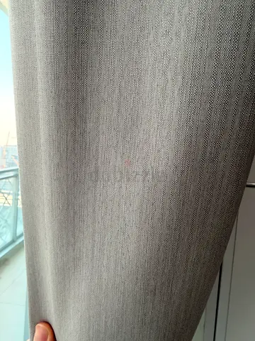 Light grey textured fabric curtain panel