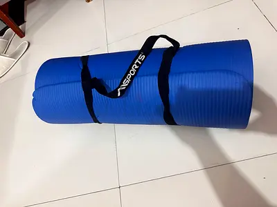 Blue thick exercise/yoga mat with carrying strap - lightly used