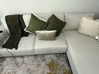 Beige L-shaped fabric sofa with cushions (good condition) from Pan Home