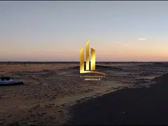 Residential land for sale in Sharjah, Al Maziraa Al Rahmaniya area, second plot from Street 36, free