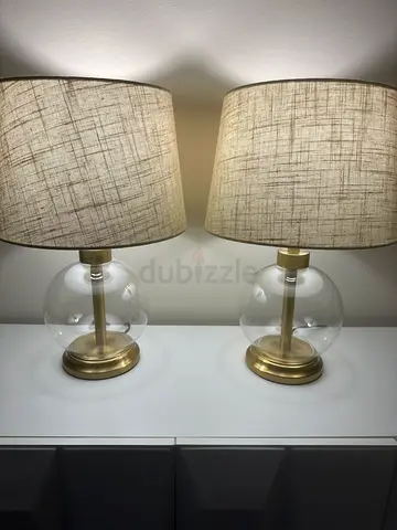 Pair of modern glass base bedside lamps with fabric shades