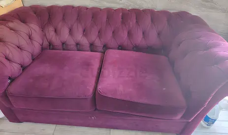 Two-seater tufted velvet sofa in plum — good condition