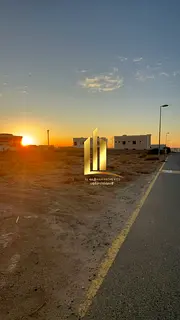 Corner residential land for sale in Sharjah, Al Raqiba, Al Suyoh suburb, next to the park. Freehold