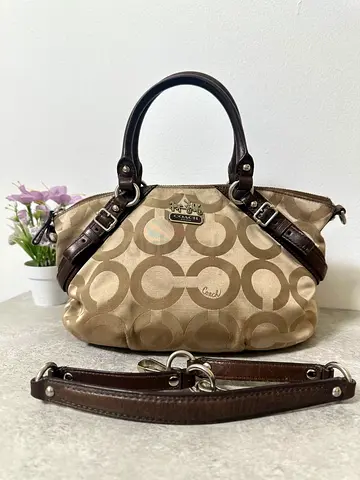 Vintage Coach Madison Graphic Op Art Sophia Satchel in beige and brown canvas with leather trim.