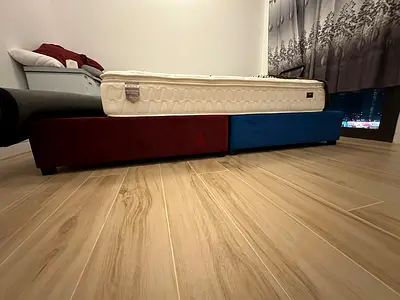 One double bed, two single beds with mattresses (new), plus an extra mattress.