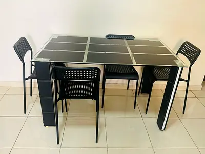 Glass-top dining table with 4 black chairs - modern set