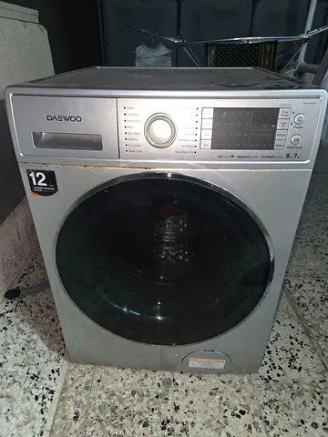 Daewoo Front Load Washing Machine 7kg - Good Working. small leak.  You can keep inside bathroom