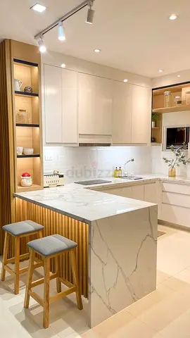 Modern White Kitchen with Marble-look Island and Breakfast Bar