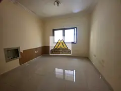A studio for annual rent in Al Rawda 1 – Ajman, featuring central air conditioning and built-in wa