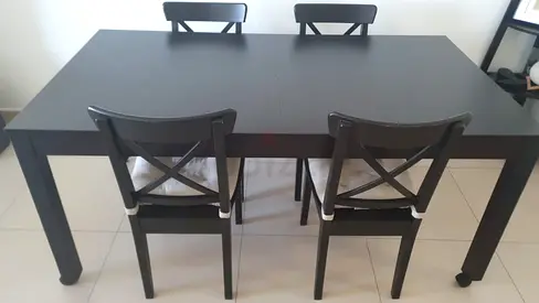 Solid Black Dining Table with 4 Matching Chairs - very Good Condition as brand new , expandable