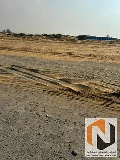 Prime corner commercial plot second plot from the main road in Al Hamriyah