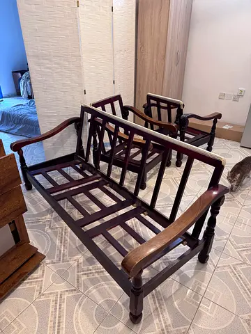 Wooden sofa and two armchairs without cushions