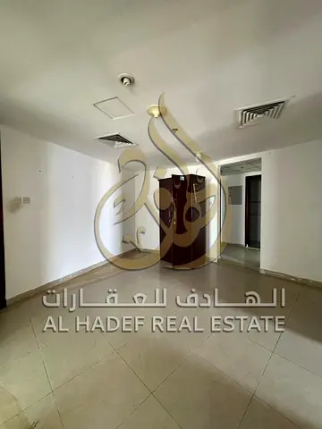 2 bedroom apartment Al Wahda Road balcony central AC free parking prime location