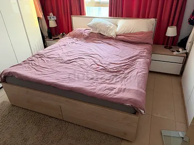 Bed with side tables and dresser