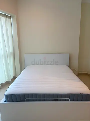 IKEA Queen-sized bed frame with huge storage. Includes mattress - brand new (4 months old only)
