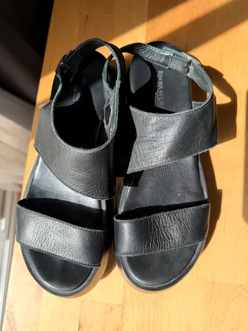 Black leather open-toe sandals, size unknown, gently used