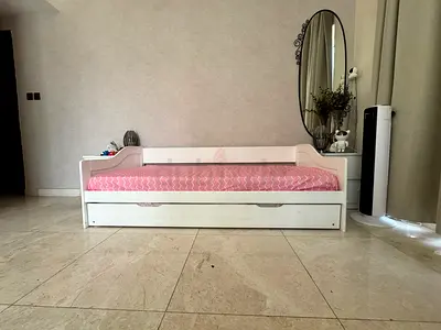 White single daybed with trundle and two mattress