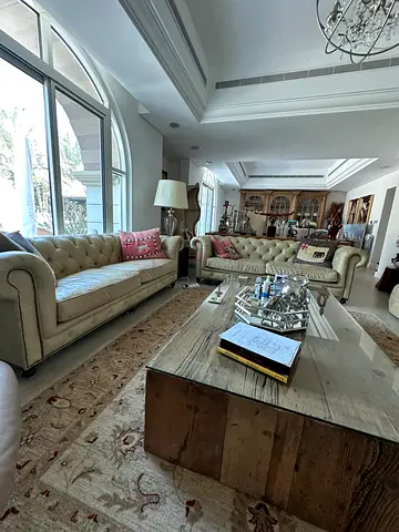 Timothy Oulton Pair of Leather Chesterfield tufted beige sofas from Marina Home.