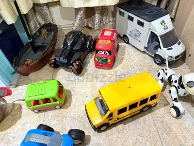 Assorted toy vehicles bundle — buses, vans, cars and more (used)