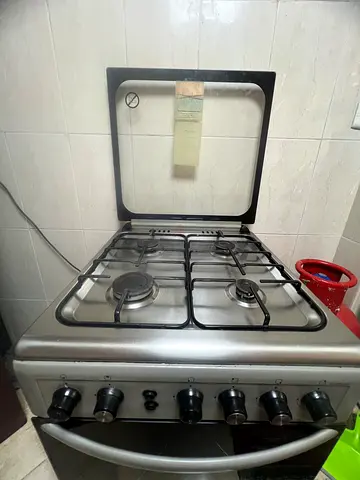 Used freestanding gas cooker with 4-burner stove and oven - good working condition