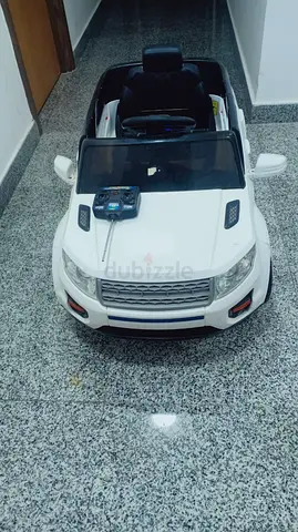 White Remote-Controlled Kids Ride-On Car (Good Condition)