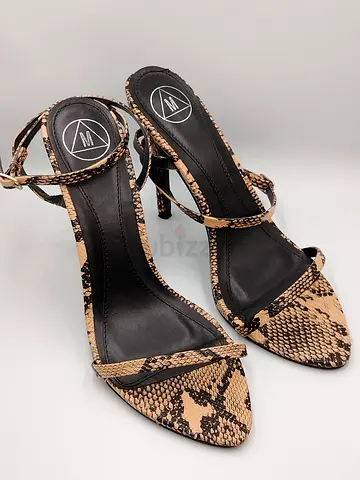 Pair of womens snake-print high-heel sandals, size 37